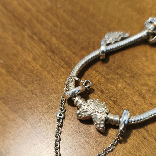 Pandora bracelet authentic used size 16 with 6 charms and safety chain