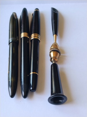Sheaffer's vintage fountain pen set with 14K gold nibs and desk base, used