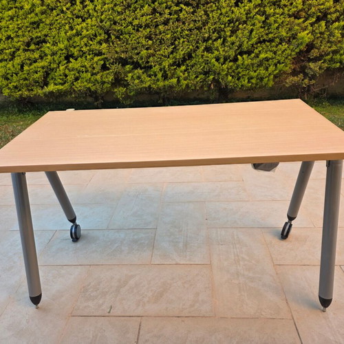 Dromeas desk with wheels used, light wood surface and metal frame