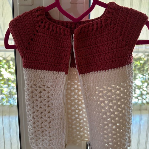 Knitted sleeveless cardigan for girl 6-12 months with crochet