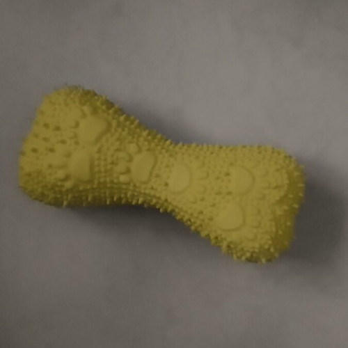Yellow plastic dog toy with squeaker