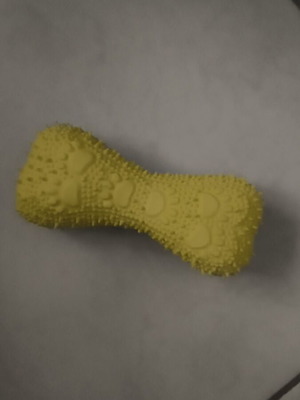 Yellow plastic dog toy with squeaker