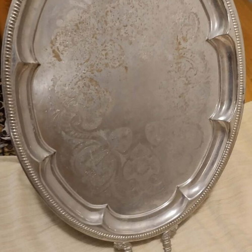 Silver-plated serving tray used with ornate handles