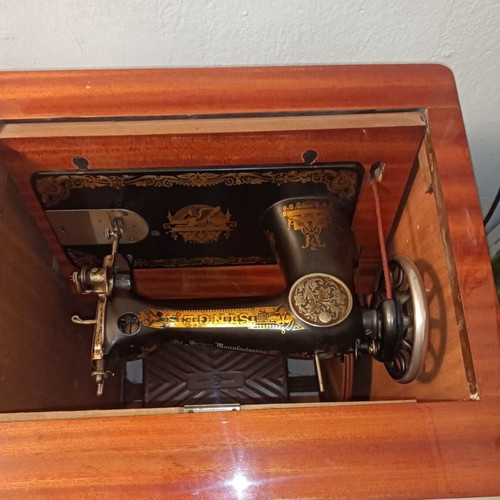 Singer Sewing Machine Model 66 like new with wooden cabinet