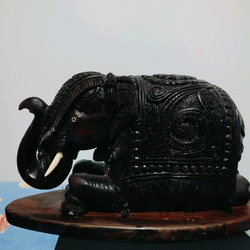 Wooden handmade elephant with carved details like new