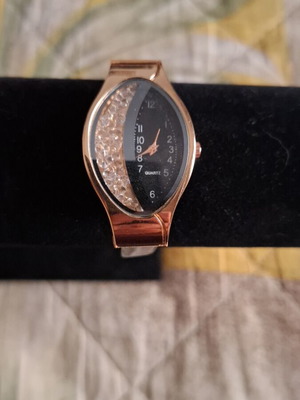 Wristwatch new with modern design in black color 25x35 mm