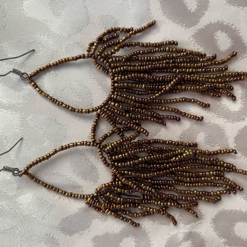 Earrings long with bead strands used