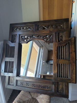 Wooden carved mirror with opening shutters like new