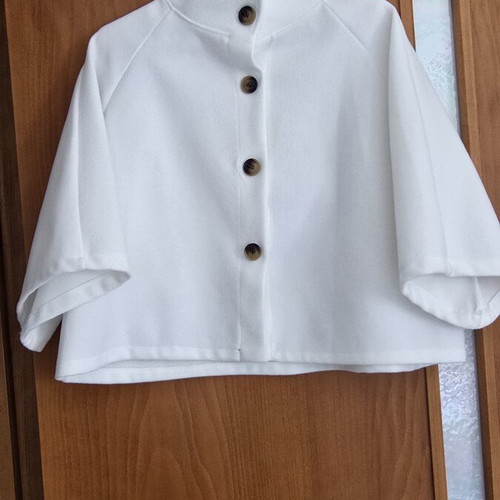 White short jacket with stand-up collar and buttons, minimal style