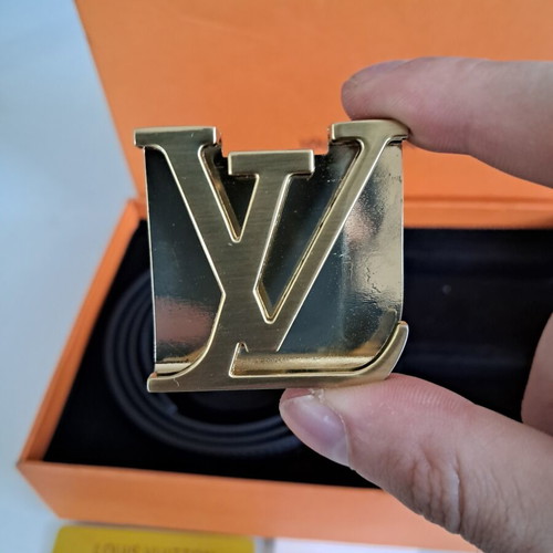 Louis Vuitton leather belt with interchangeable buckles