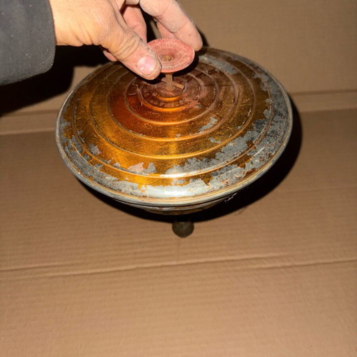 Old iron spinning top used in moderate condition