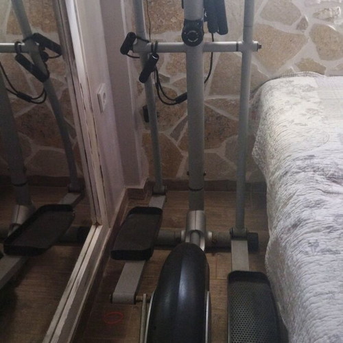 Elliptical machine used for full body fitness and exercise