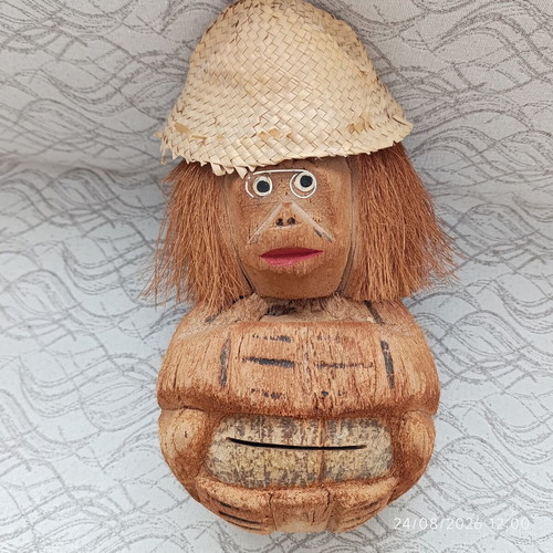 Handmade coconut shell money box with straw hat