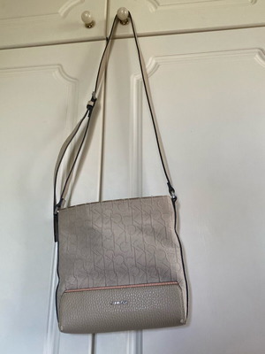 Calvin Klein crossbody bag used, beige with embossed logo