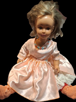 Vintage doll used with pink satin dress and knitted boots