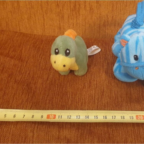Two small plush toys with vibrating tails like new