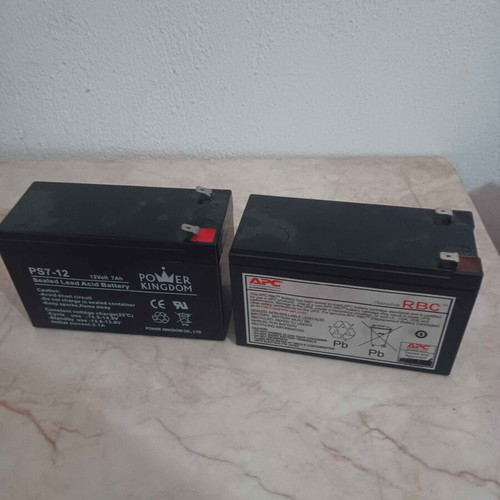 2 UPS batteries 12V 7Ah, one with edge damage