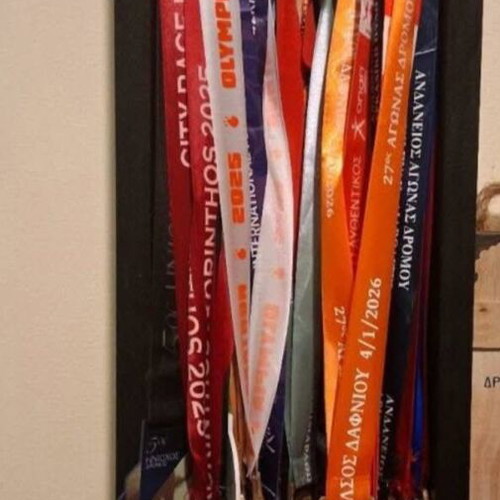 Handmade wooden medal display case with running race medal collection used
