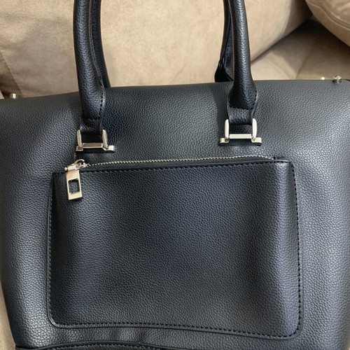 Black handbag with studs used, includes detachable pouch