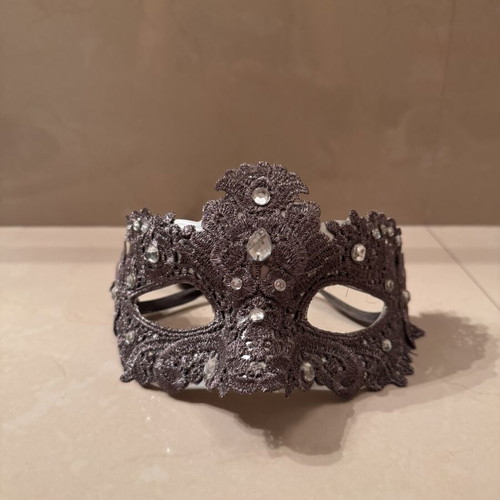 Two ornate masks like new, one gray and one white