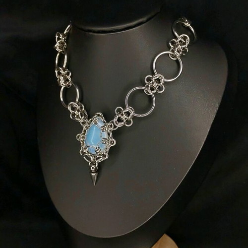 Handmade necklace made of steel and stone like new, silver color