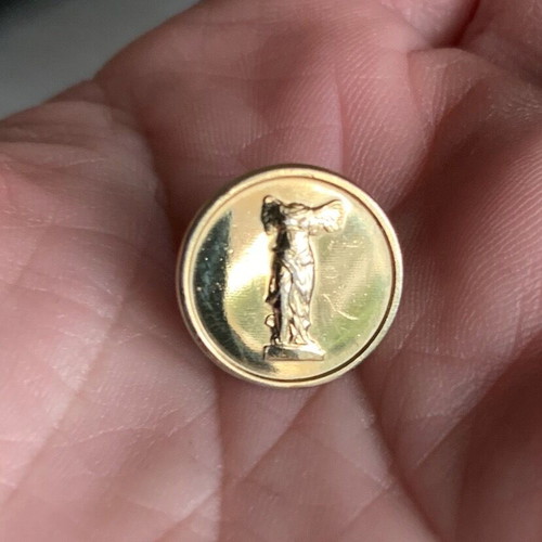 Gold-plated pin badge 'Nike of Samothrace' used