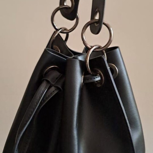 Pink Woman black bucket bag used, soft faux leather with metal details
