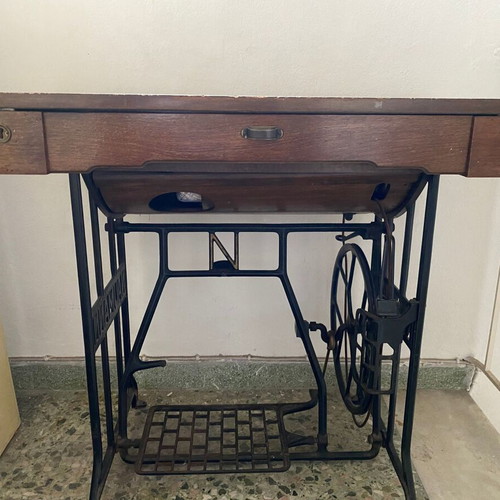 Naumann sewing machine used with cabinet and wheel