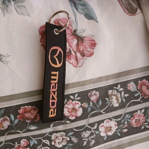 Mazda keychain like new, black and multicolor