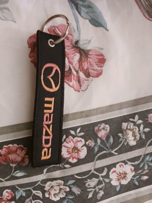 Mazda keychain like new, black and multicolor