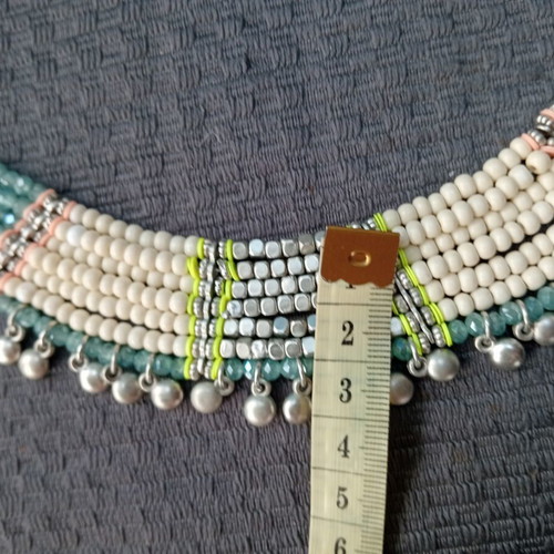 Accessorize multistrand necklace with plastic and glass beads