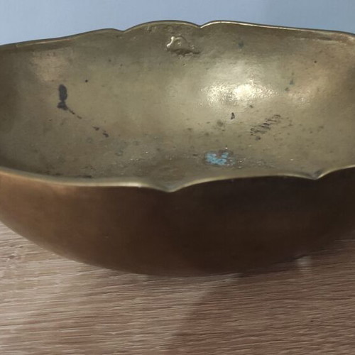 Vintage decorative brass bowl with two handles and wavy rim