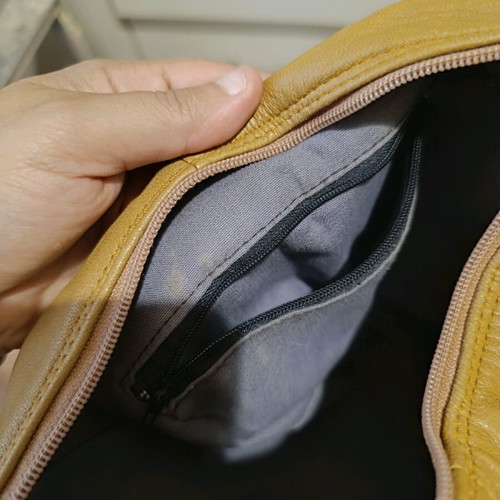 Leather backpack beige like new with multiple pockets and zippers