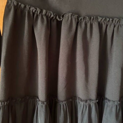 Women's blouse like new, black with tulle ruffles