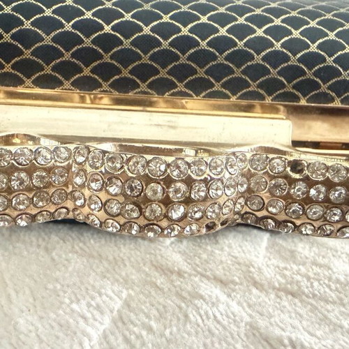 Evening bag like new with unique clasp and black-gold rhinestones