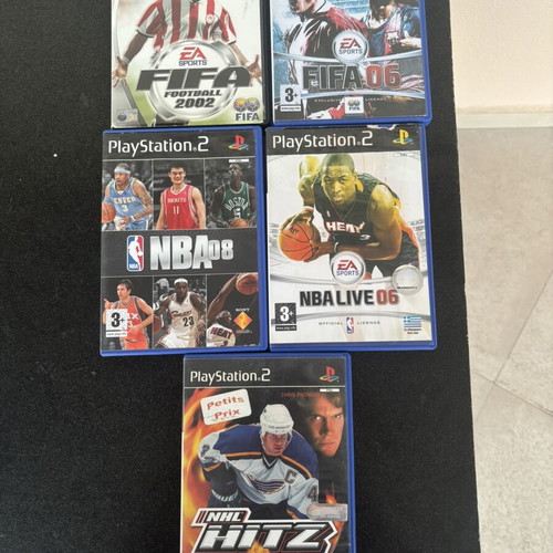 Bundle of used sports games for PlayStation 2 with manuals