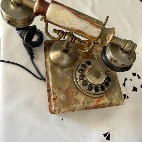 Antique rotary phone used with nephrite