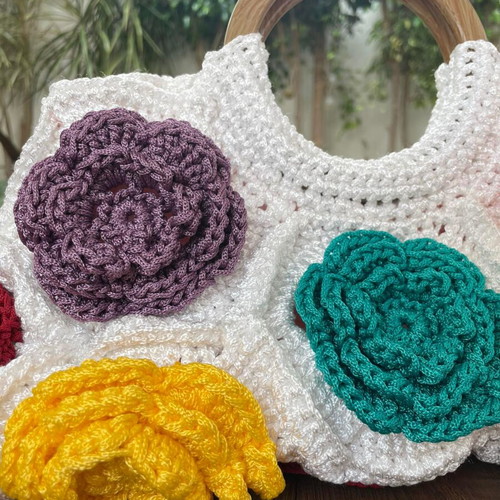 Handmade crocheted handbag with wooden handles and colorful flowers new