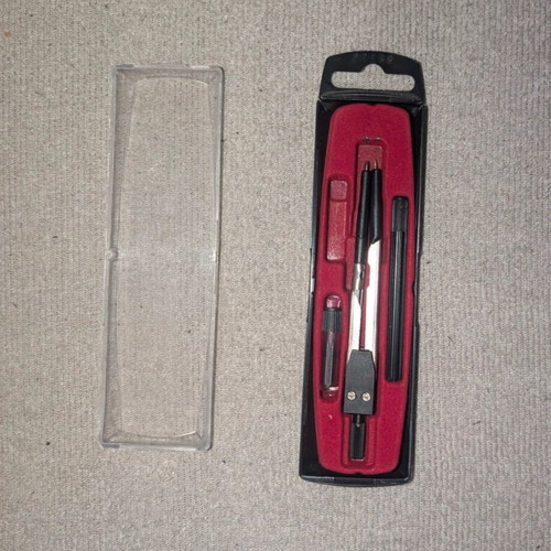 Compass with extender and tips used with case