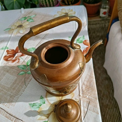 French teapot used with vintage brass decoration