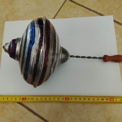 Vintage metal mechanical spinning top used