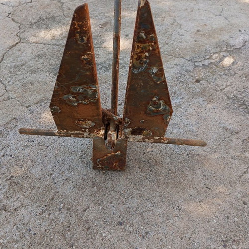 Anchor used for small boat, old and rusty