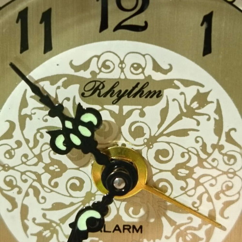 Bronze wind-up clock-alarm Rythm Japan used, 1960s design