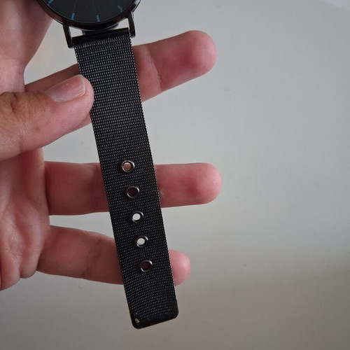 Geneva wristwatch used with black mesh metal strap