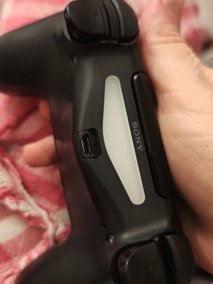 PlayStation controller used, somewhat worn but functional