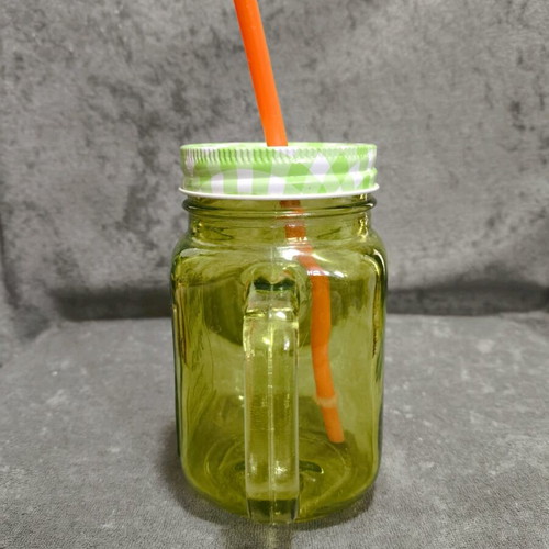 Glass cup with straw used, straw needs replacement