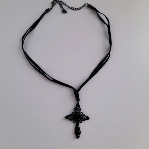 Black metal cross necklace like new with shiny stones on velvet ribbon