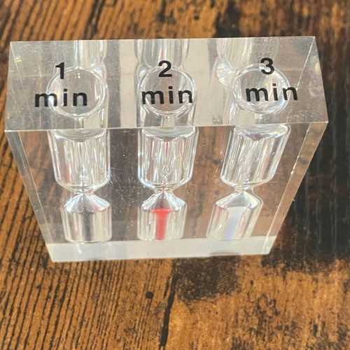Hourglass with 3 time intervals (1, 2, and 3 minutes) used