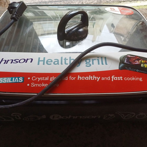 Electric grill used 2200 W with glass lid and adjustable thermostat