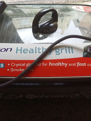 Electric grill used 2200 W with glass lid and adjustable thermostat
